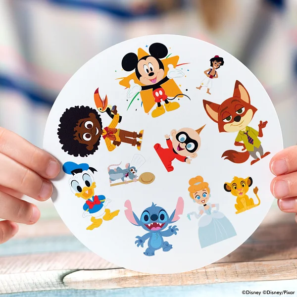 A group of people playing Dobble Disney around a table