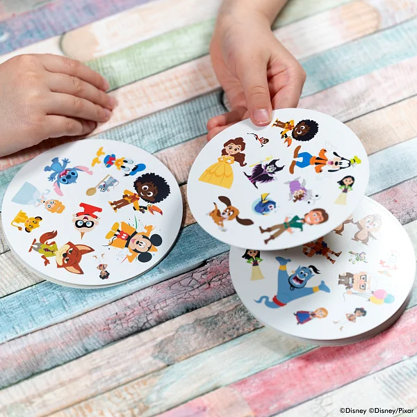 Players pointing at cards with Disney characters