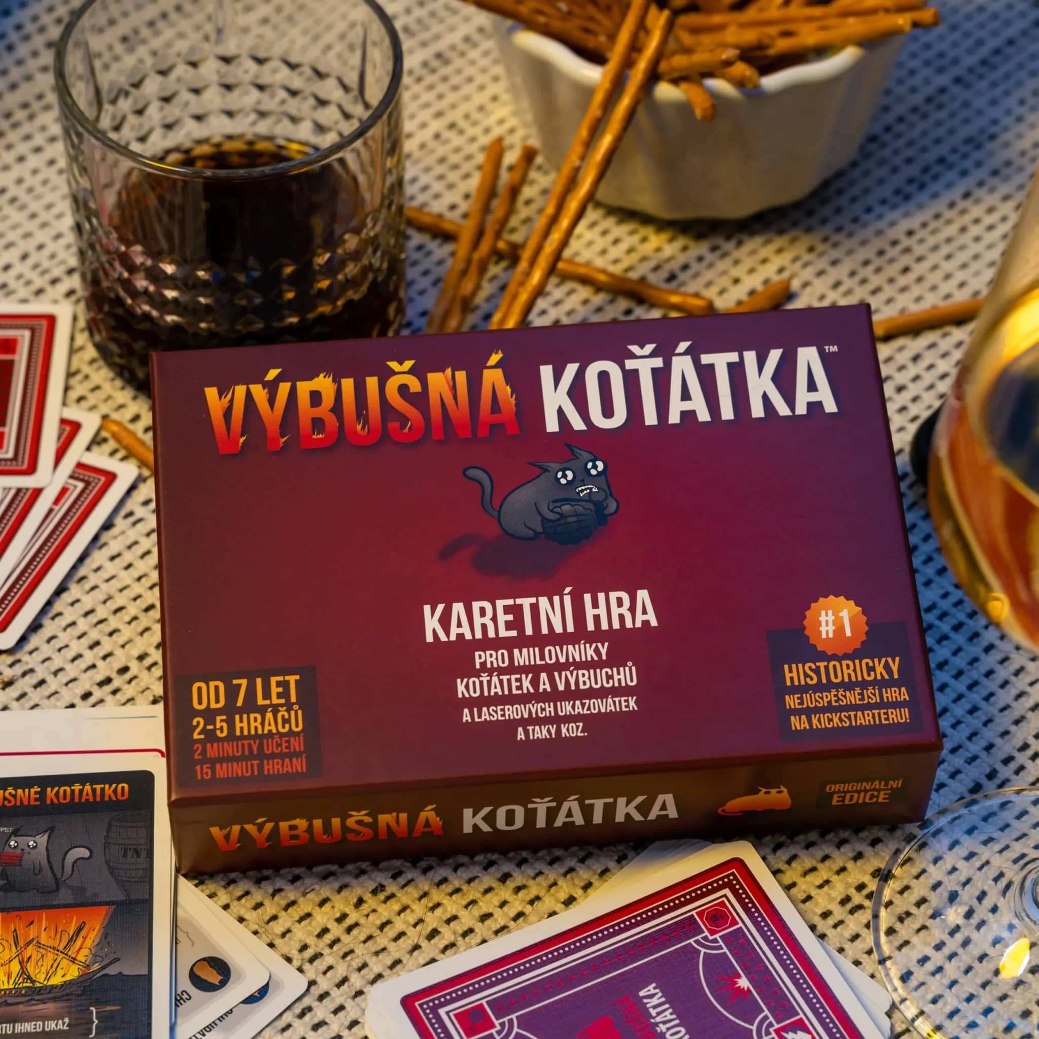 Players laughing during a tense turn in Exploding Kittens.