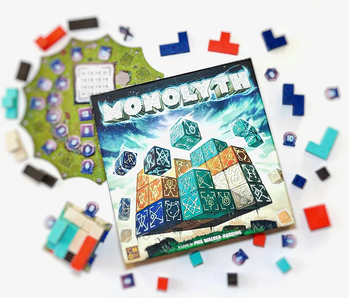 Detailed view of the laid-out MONOLYTH game with components