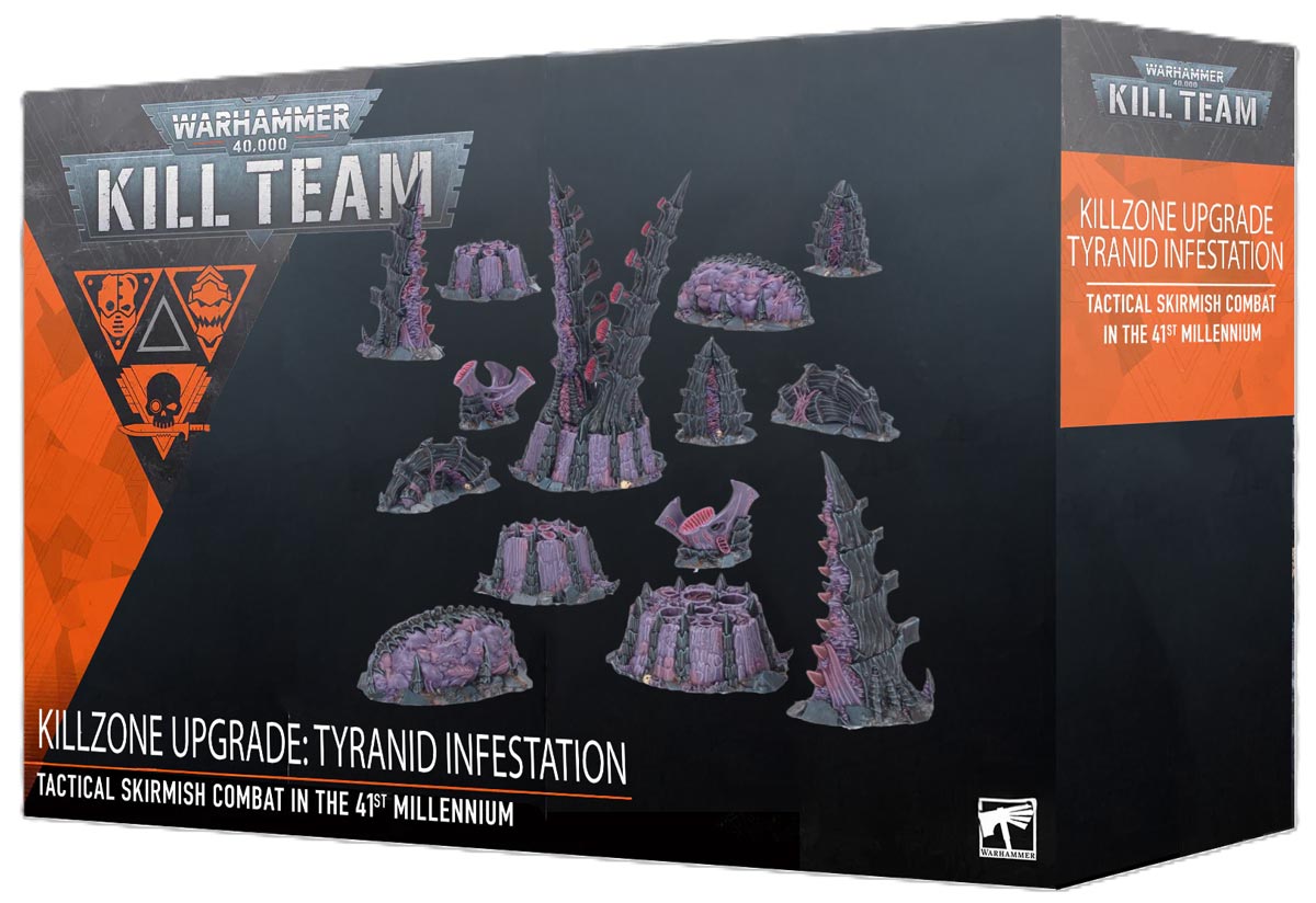 Wide shot of a gaming table featuring integrated Tyranid terrain elements.
